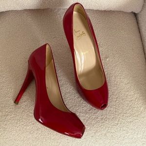 Christian Louboutin patent peep toe heels. Great condition. Barley worn.